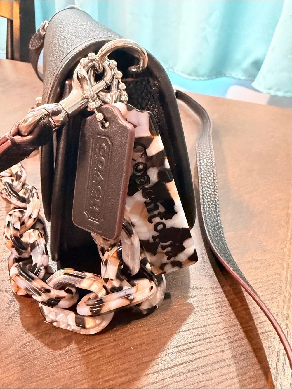 Coachtopia Wavy Dinkey black Pebble Leather Crossbody with acrylic chain.